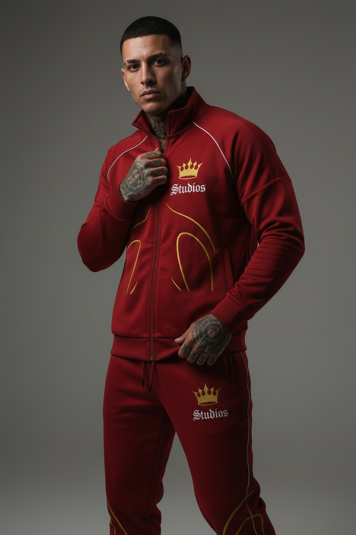 Streetwear model in zipped burgundy Studios tracksuit